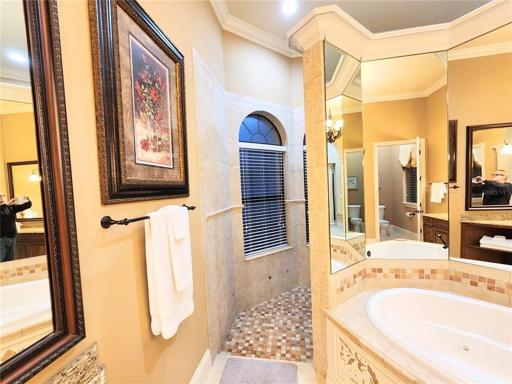 1st Floor Master Suite Bathroom 1:  leading into U-Shaped All Tile Shower