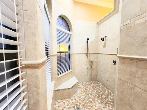 1st Floor Master Suite Bathroom 1:  leading into U-Shaped All Tile Shower behind Tub