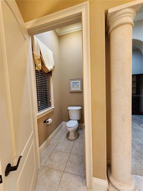 1st Floor Master Suite Bathroom 1: Private Toilet Area with Door