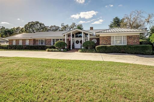 Stunning 3/3 Home on the #18 Fairway in Prestigious Lone Palm. Large Circular Driveway with Side Garage entry.
