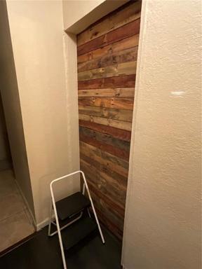 end of hallway from laundry
