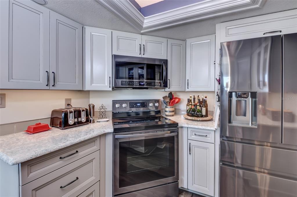 New Wood Cabinets with pot drawers and soft close. New Samsung Appliances