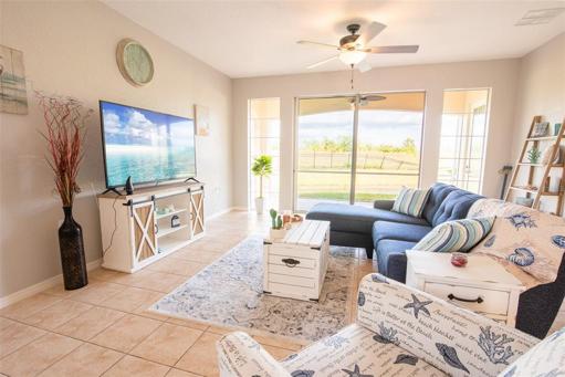 Living room with sliders to screened lanai.