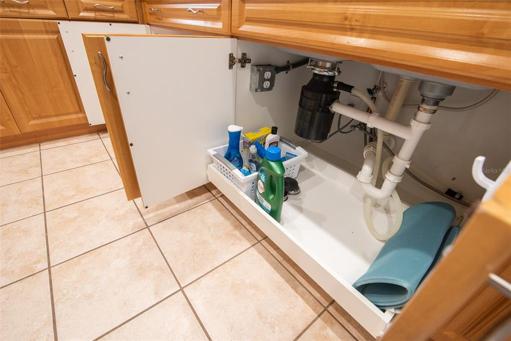 pull-out under-sink cabinet for added convenience