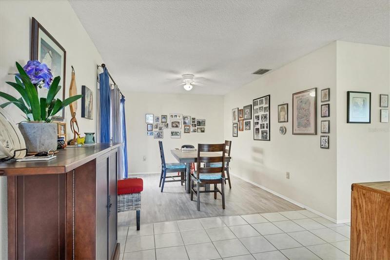 The view from the front entry to the dining area with sliding doors to a small patio are awaiting your personal touch.