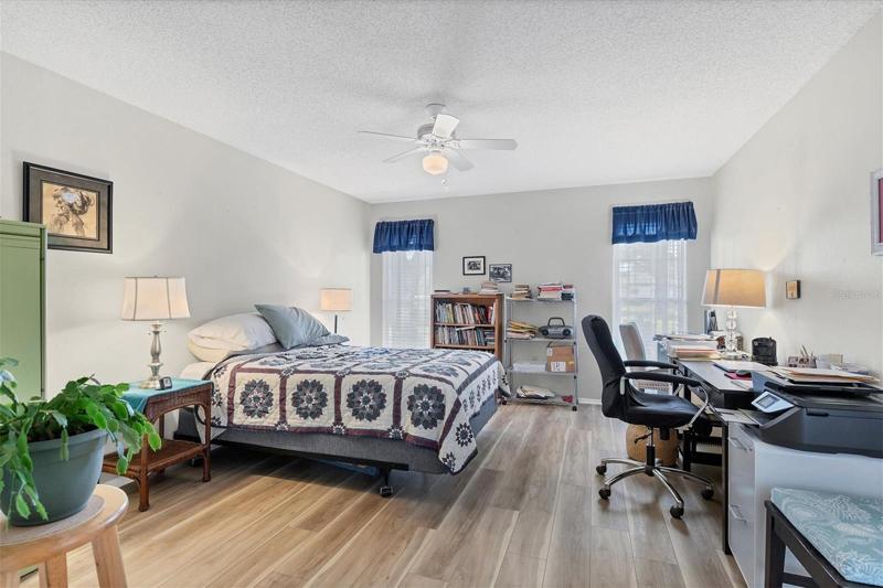 A generous sized primary bedroom with a walk-in closet and ensuite bathroom.