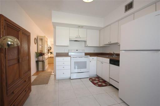 Another view of the kitchen, looking towards the front of the condo.