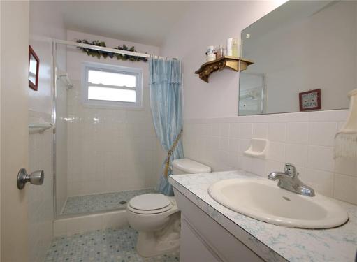 Master bathroom with a walk in shower.