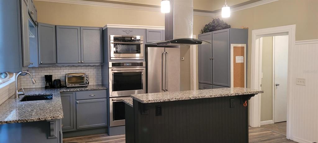 To the right is laundry room and a bath with shower.