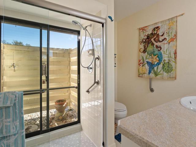 Bedroom 1 bathroom with sliders to outside garden space. New glass doors.