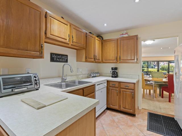 Tiled kitchen open to breakfastnook