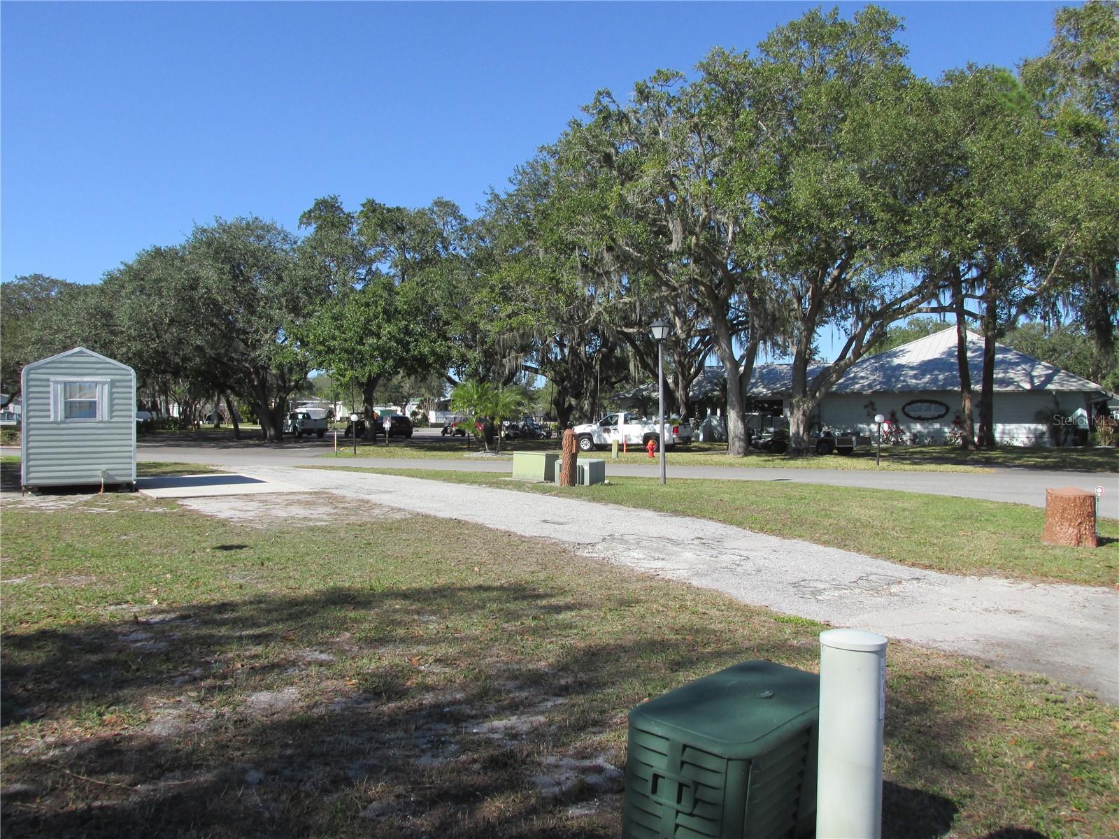 Complete pull-through driveway runs diagonally through the lot.