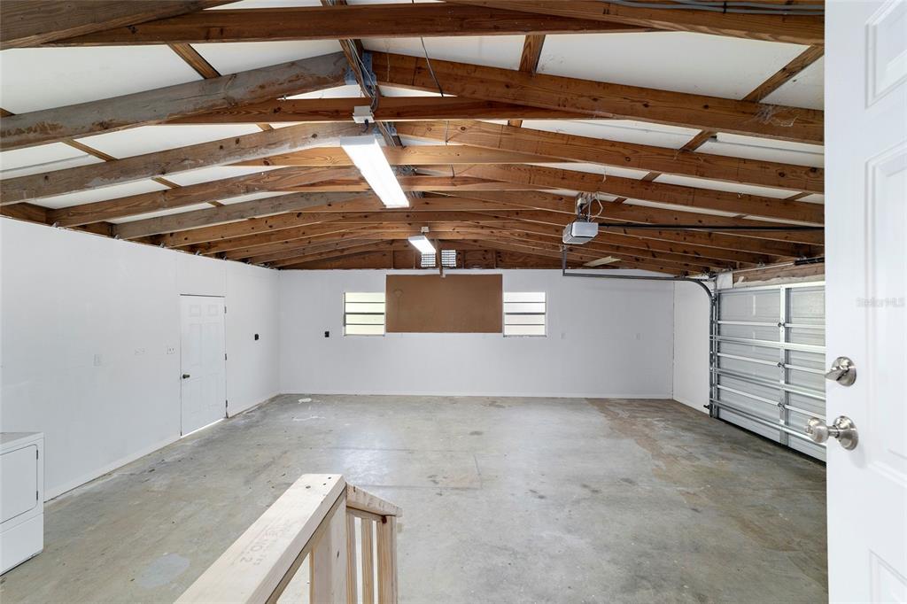 Huge garage with washer and dryer and large work area