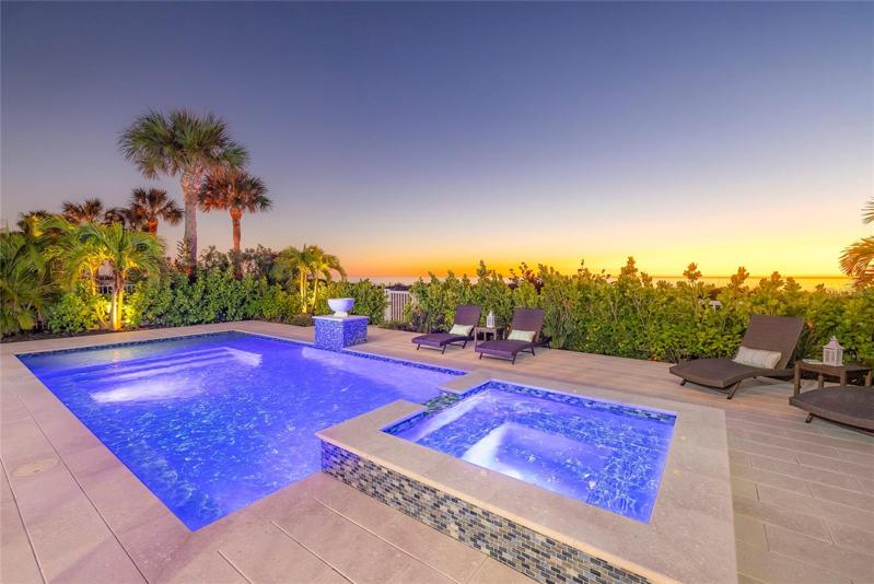 Heated pool & spa. Landscape provides privacy and fiber optic light system provides a beautiful variety of colors.
