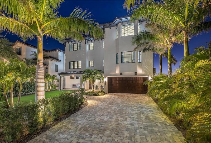 Beautiful landscape and outdoor lighting wrap this home. Possible 5 car tandem parking in the main house.