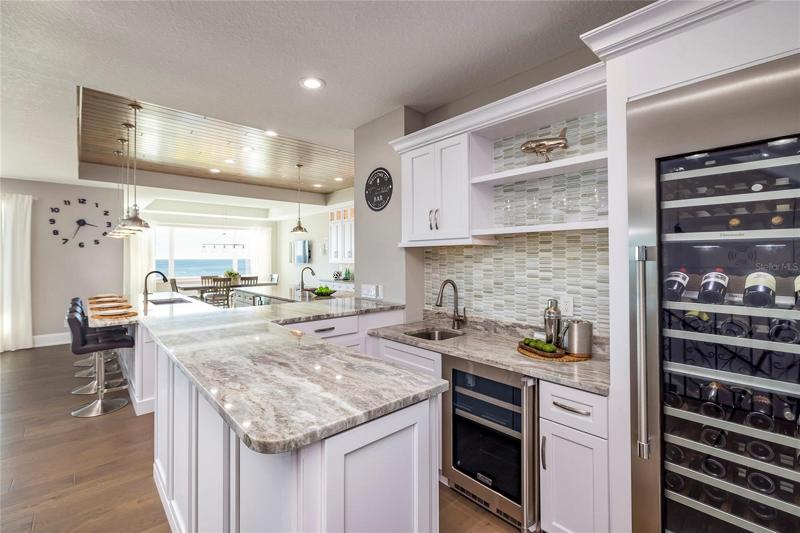 Wet bar with beverage refrigerator and Thermodor 3-zone wine refrigerator.