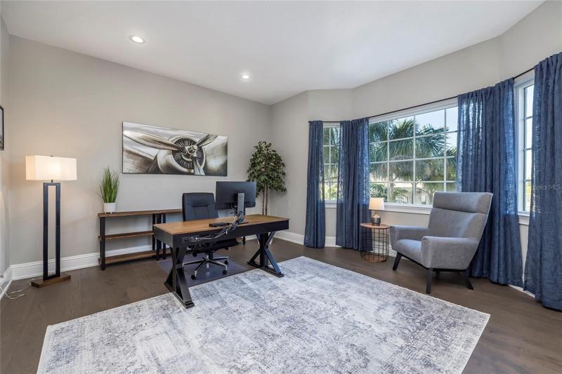 The office is conveniently located on the same floor as the great room, kitchen, and dining room with easy access to the powder bath. There is a walk in closet in this room so can be used as a Fifth Bedroom.