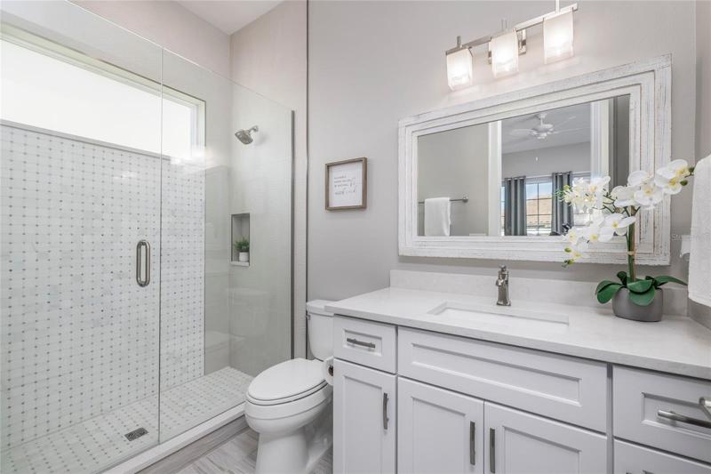 Ensuite bathroom for guest bedroom on second floor.