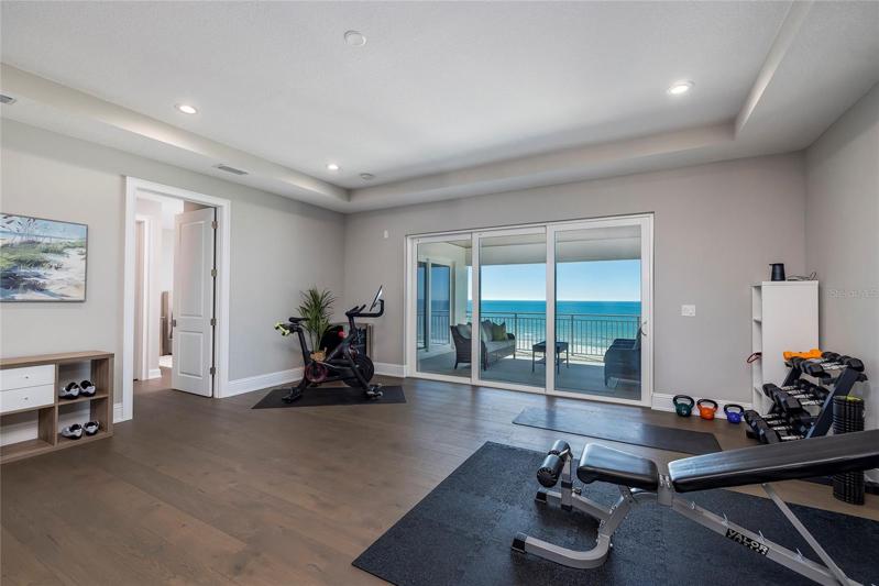 This huge second floor family room can be used as an exercise room, a media room, a family room, a game room, or guest sitting area. The owner's suite, large guest suite, guest bedroom, full bath, and laundry room share the third floor. The elevator services all three floors of this home.