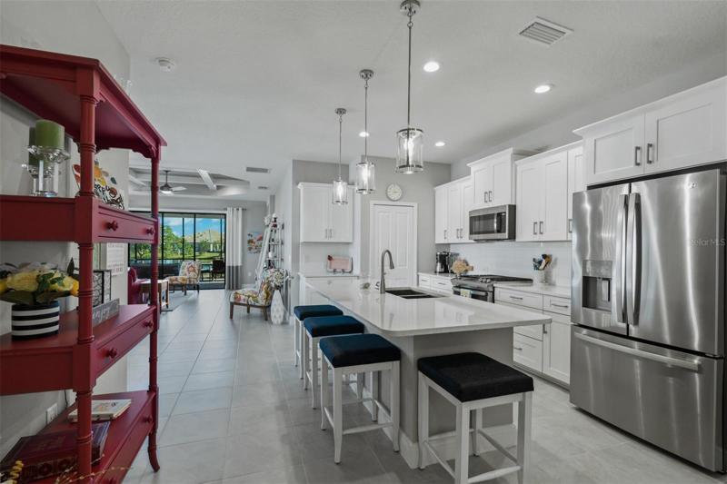KITCHEN WITH QUARTZ COUNTER TOP AND ISLAND