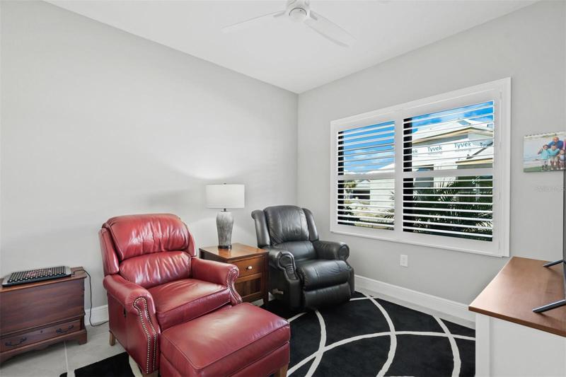 DEN WINDOWS HAVE PLANTATION SHUTTERS