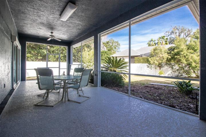 Screened and covered lanai overlooks large rear yard.
