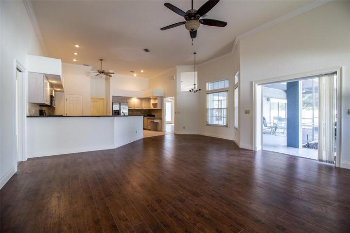 View from Family Room to Breakfast Area and Spacious Kitchen.