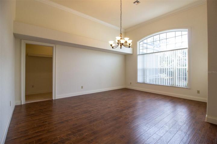 Formal Dining Room view to hallway leading to Kitchen, Laundry and Garage.
