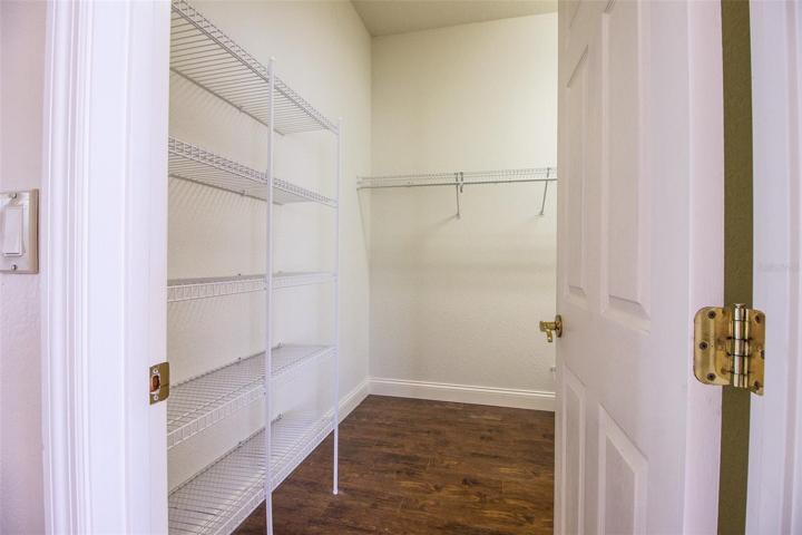 Walk-in closet has shelving and ...