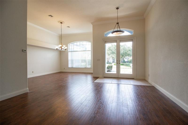 View from Formal Living Room to Formal Dining Room and Front Entry.