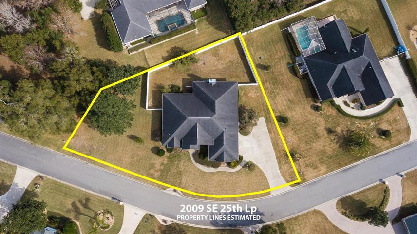 Lots of yard!  Note how much area is outside the fenceline on the left side of the home.