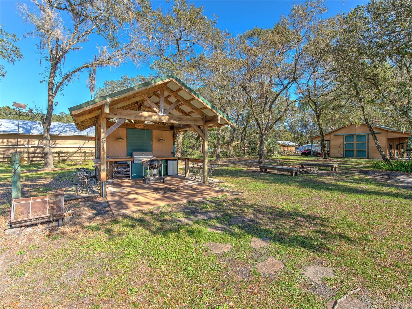 Custom Outdoor Cowboy Kitchen with bar seating. Perfect for parties, grilling &amp; entertaining in the backyard.