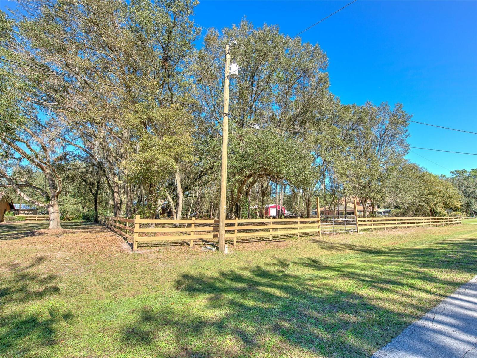 Street View of entrance to fenced &amp; vacant side of property - PERFECT for Horses &amp; has a POLE BARN