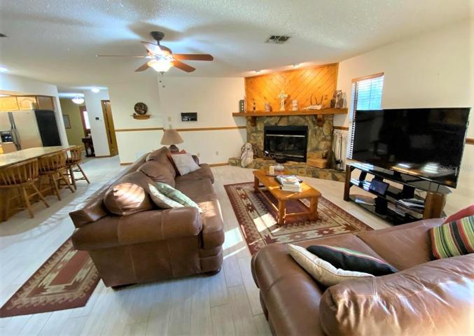 Family Room with Stone wood burning fireplace