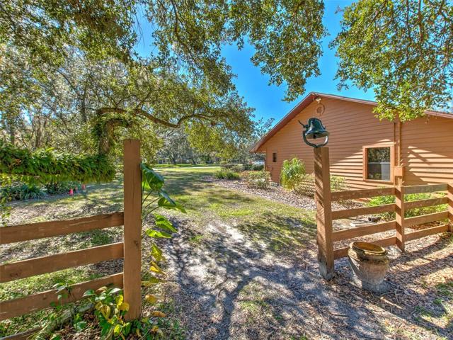 Side of home near middle of property
