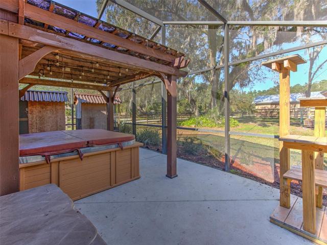 Back Screened in Lanai also features a separate area with pergola and jacuzzi