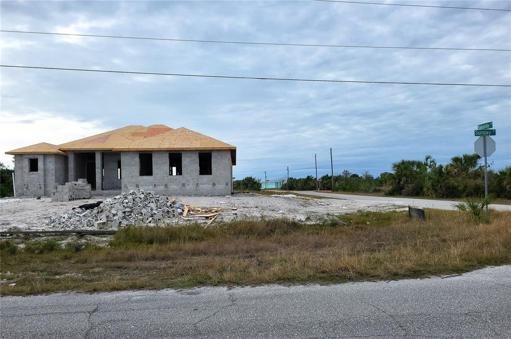New home under construction on the opposite corner lot to the west.