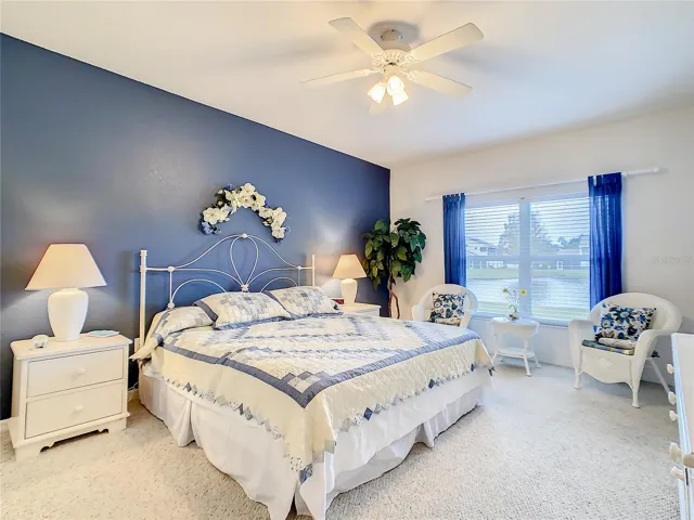 Main bedroom with king bed and water view