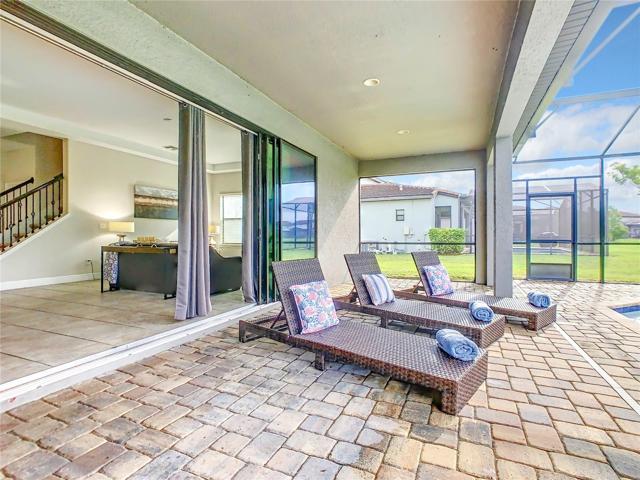Patio doors open on to pool deck.
