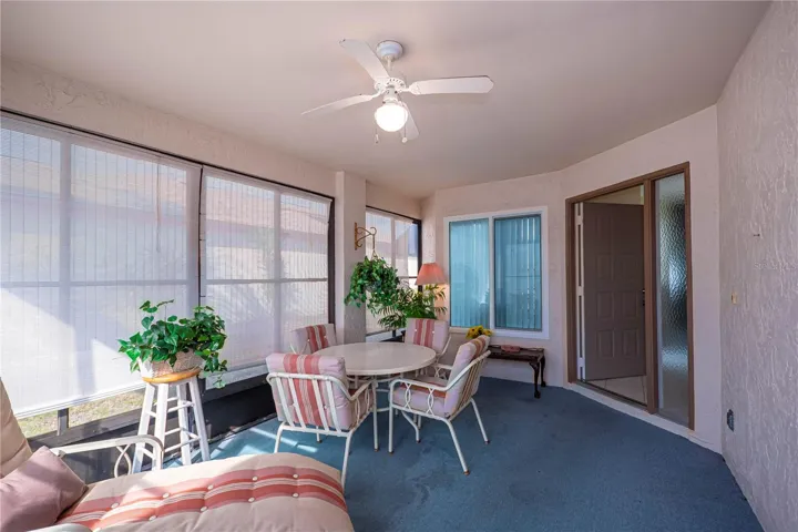 As you enter, there is a pleasant front porch w/windows and screens to cover all seasons.  Room for lounging, visiting and a table for eating and games!