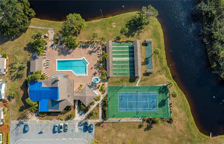 Aerial view of the club's amenities.  Large pool, hot tub tennis court, bocce ball, shuffleboard!  Just a sample of the fun to be had in this community