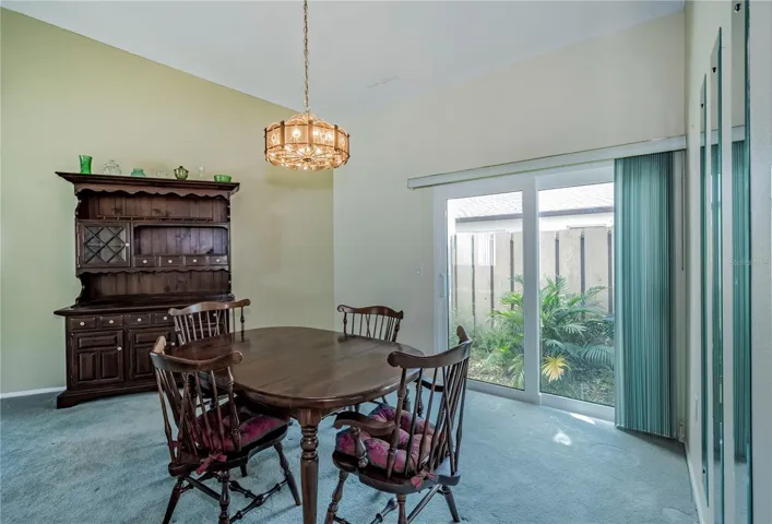 Another view of the dining room showing the patio doors onto a