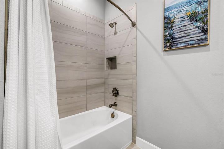 Upstairs Guest Bathroom with large tub