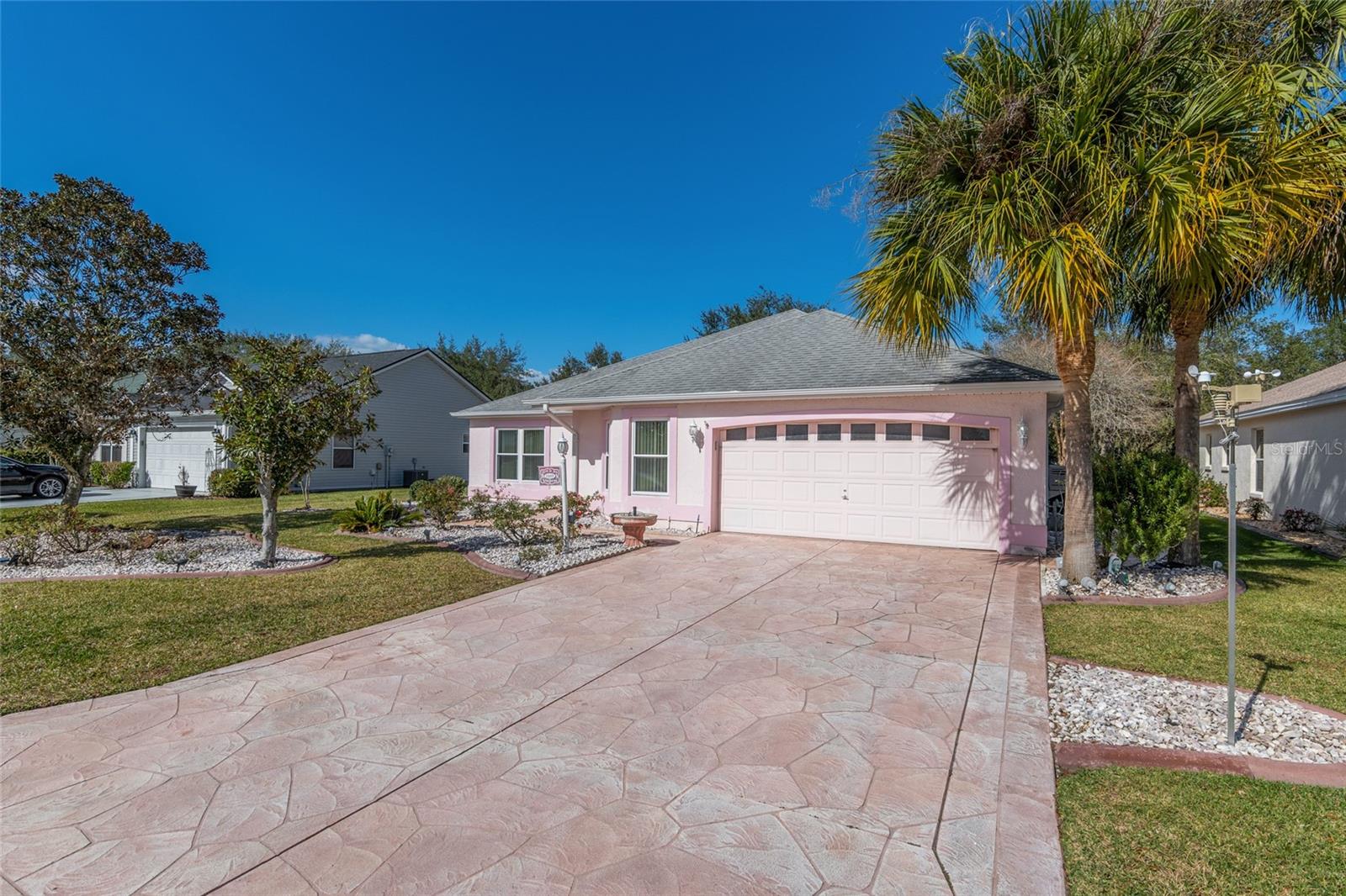 FRONT EXTERIOR View shows IMPRINTED CONCRETE DRIVEWAY &amp; WALKWAYS (L) &amp; (R)