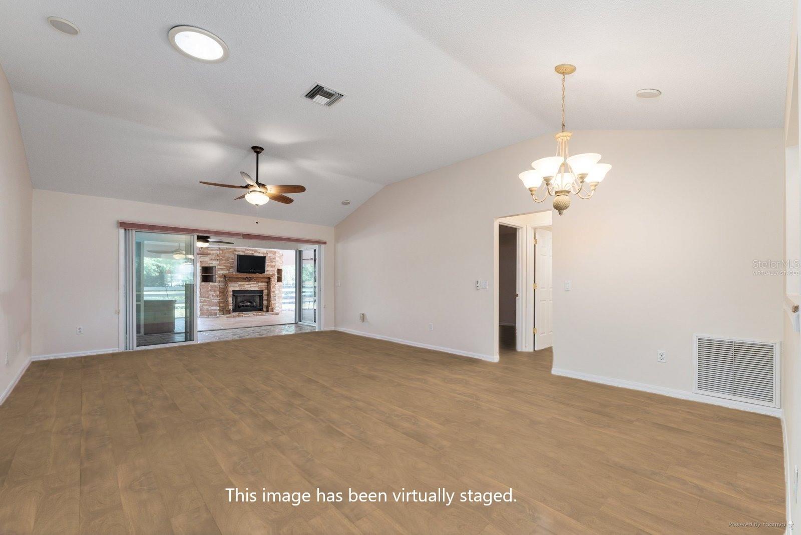 VIRTUALLY STAGED - Just imagine what LUXURY VINYL PLANK flooring would look like here in the COMBO LR/DR area!