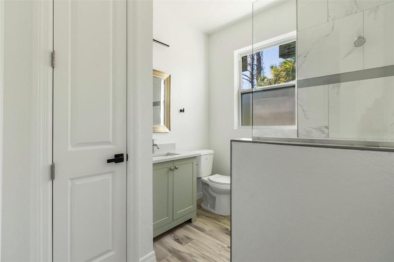 GUEST BATHROOM WITH TUB AND CLOSET