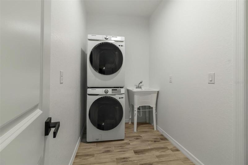 LAUNDRY ROOM WITH MODERN AND BRAND NEW WASHER AND DRYER