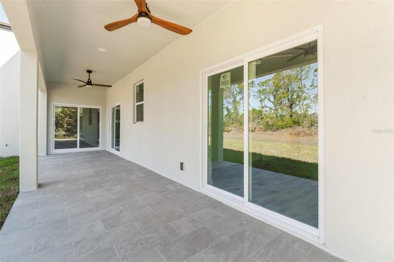 SLIDING DOORS FROM BEDROOMS AND KITCHEN TO BACK PORCH