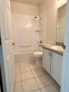 3rd bedroom or office area off living room with extra closet space