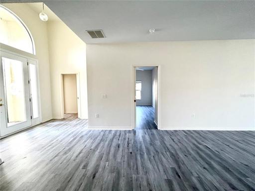 Dining room looking onto front door and guest bedroom/office area